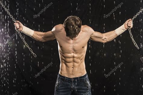 Image Of Muscle Man With Chains Posing In Water Studio Stock Photo Mkolesnikov