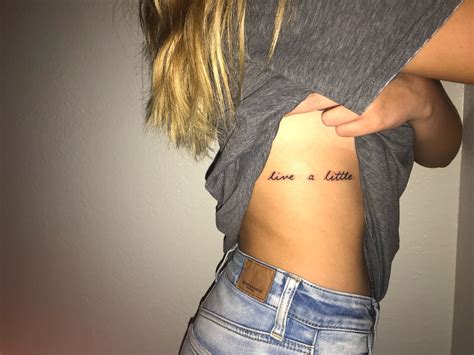 live a little tattoo. simple tattoo. small tattoo. rib tattoo. women's tattoo. quote tattoo 
