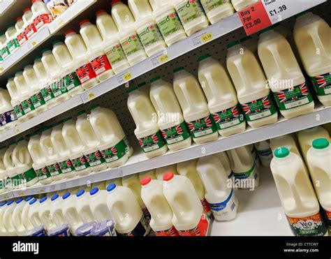 Milk On The Shelves Of A Supermarket Aisle Uk Stock Photo Alamy
