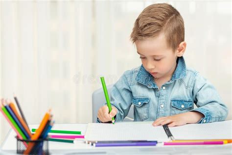 Little Boy Doing Homework Writing And Painting Preschooler Learn To
