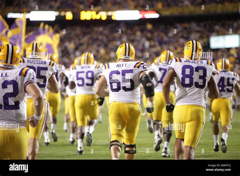 Offensive Lineman Lyle Hitt And The Lsu Tigers Take The Field During The Game Between The