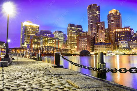 The Boston Skyline At Night Located In Fan Pier Park Boston