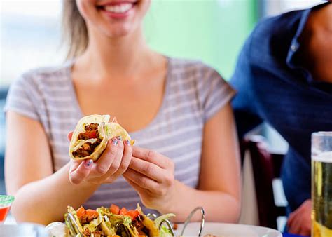 People Eating Tacos Stock Photos Pictures And Royalty Free Images Istock