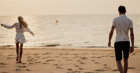 Man And Woman Walking On Beach · Free Stock Photo