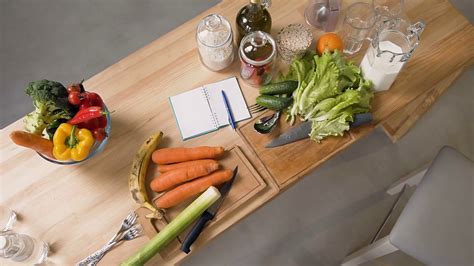 Top View Of Vegetables And Fruits On Wooden Table In Home Kitchen