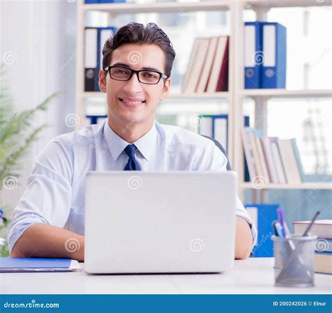 Businessman With Excessive Work Paperwork Working In Office Stock Photo