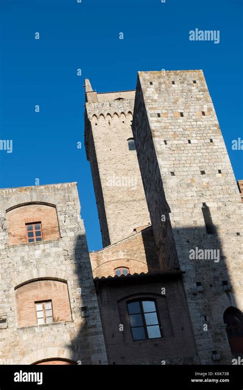 towers in the piazza della cisterna the main square in san gimignano tuscany italy europe eu