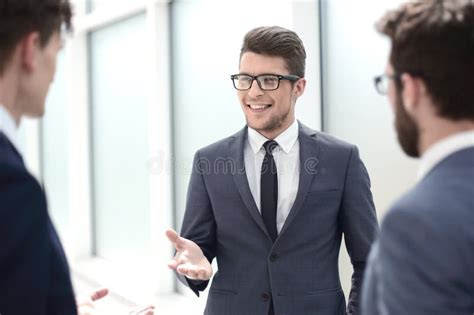 Boss Talking To Employees Standing In The Office Stock Image Image Of
