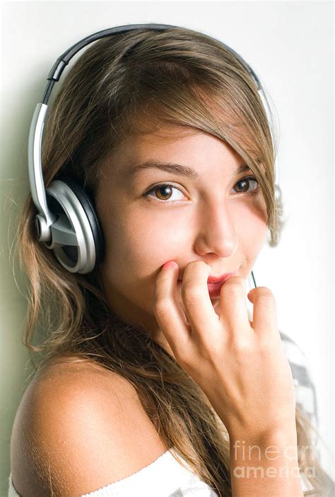 Shy Young Brunette Listening To Music With Headphones Photograph By