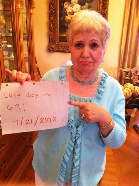 An Older Woman Holding Up A Sign That Says Last Day Im 6 21 2012