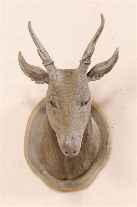 Check spelling or type a new query. Masterfully Carved Faux-Taxidermy Deer Head Wall Decoration For Sale at 1stDibs