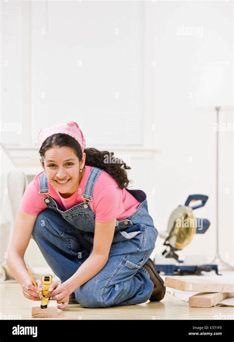 Woman using power tools at home Stock Photo - Alamy