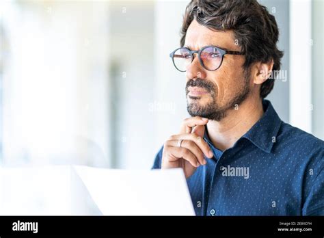 Business Man Wearing Glasses Holding Paper Document Looking At The Window Successful Male