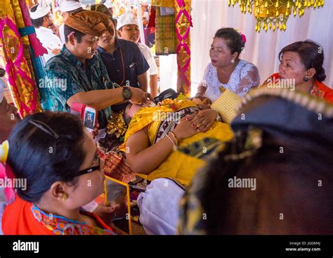 teenage girl during the rite of passage tooth filing ceremony bali island canggu indonesia