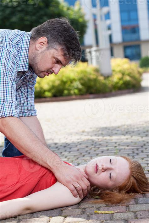 Man Helping Unconscious Woman Stock Photo At Vecteezy