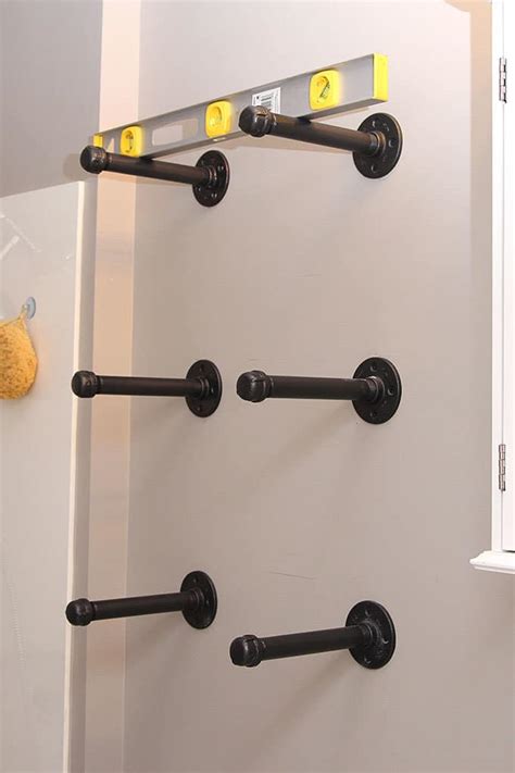 The metal pipe is used for plumbing. DIY Floating Industrial Pipe Shelves