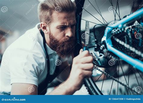 Bike Mechanic Repairs Bicycle In Workshop Stock Photo Image Of Sport