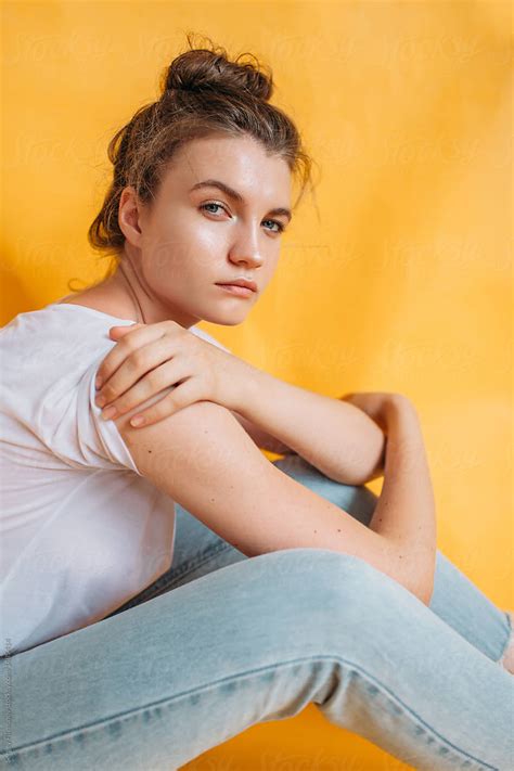 portrait of teen model on yellow background by stocksy contributor serge filimonov stocksy