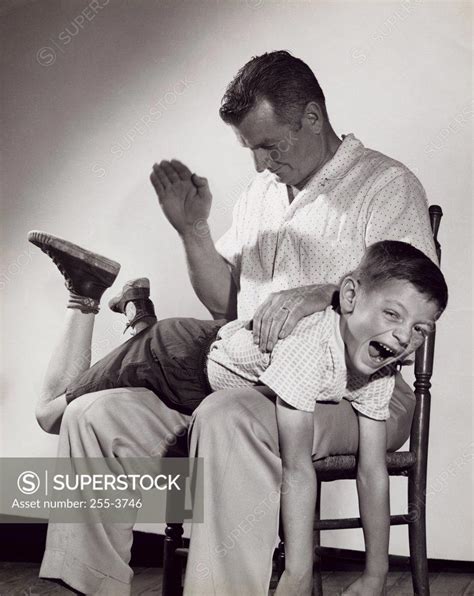 Father Spanking His Son SuperStock