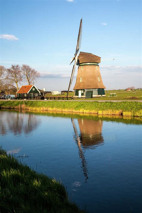 Netherlands, Lisse, Windmill On A Canal Photograph by ...