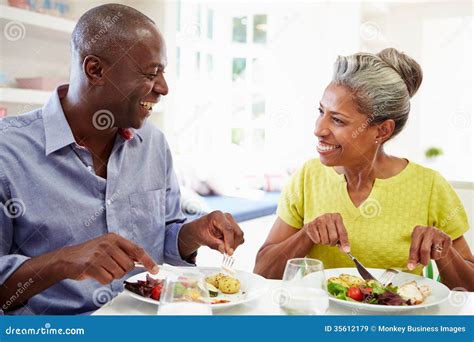 Mature African American Couple Eating Meal At Home Stock Image Image