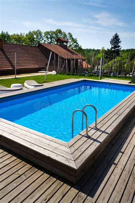 Beautiful Outdoor Skimmer Swimming Pool With Wooden Flooring Steel