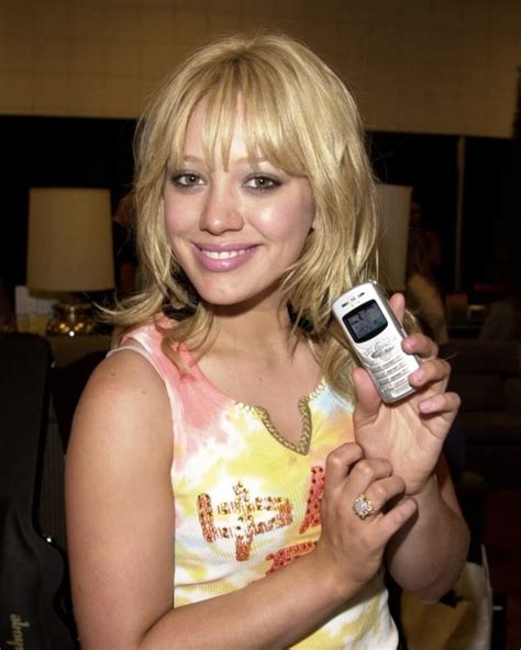 Celebrities Showing Off Their Now Old Phones