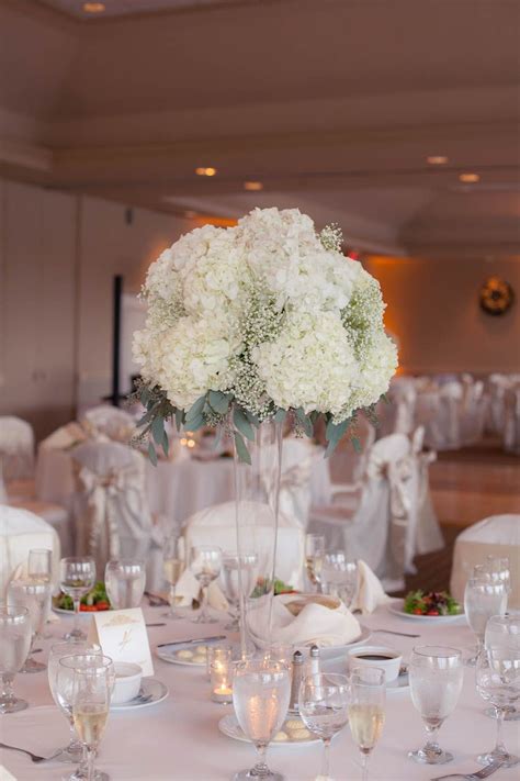 Tall centrepieces with blue hydrangea can make any event look luxury and stylish materials used: Elegant Ivory and Champagne Golf Course Wedding | Wedding ...