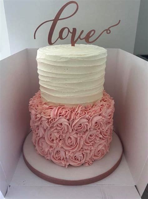 a 2 tier buttercream wedding cake in cream pink and rose gold i forgot to take modern
