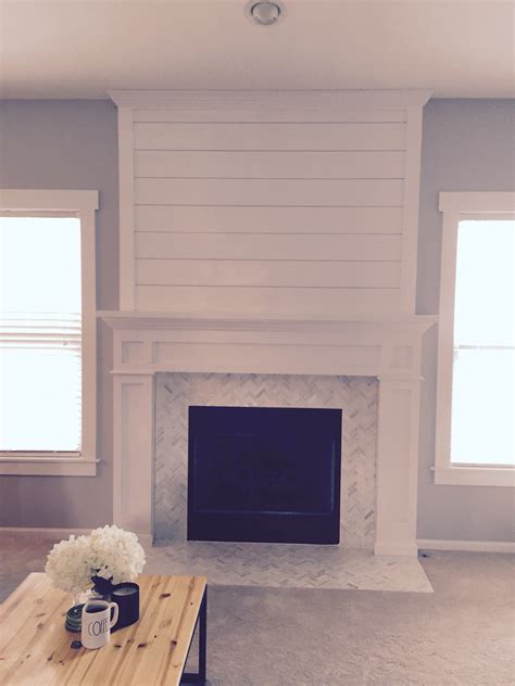 I'm veering off the path of the master bathroom remodel to bring you our diy shiplap fireplace surround makeover. Shiplap fireplace