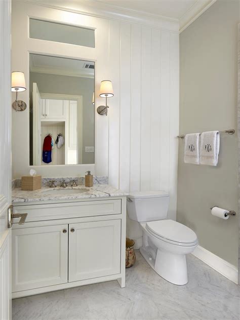 Traditional Guest Bathroom With White Paneling And Marble