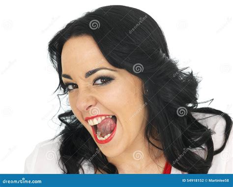 Cheeky Beautiful Young Hispanic Woman Pulling Silly Faces And Sticking
