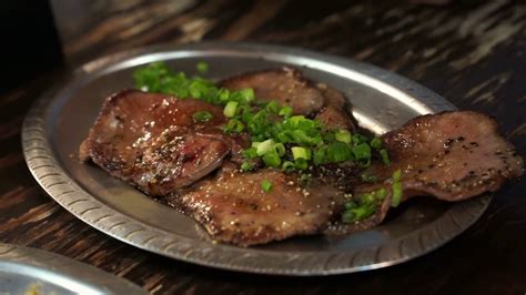 While the potatoes are cooking, put 150ml of chilled sour cream into a small bowl. Japanese grill beef tongue slice on plate with lemon in ...