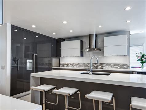 Quartz countertops are often made quartz is a crystal like mineral that comes in a variety of colors from clear, milky white and smoky grey to pale shades of purple, pale yellow and pale pink. high gloss cabinetry, white quartz countertops, waterfall ...