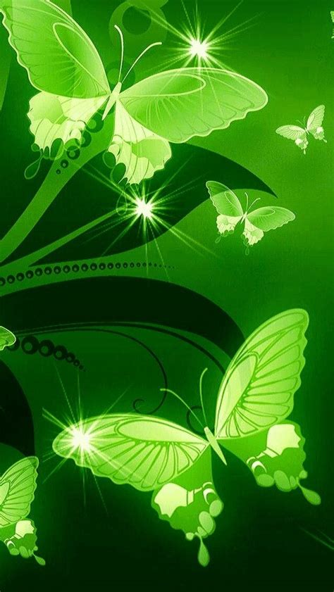 Green Butterflies Are Flying In The Air With Light Shining On Thems