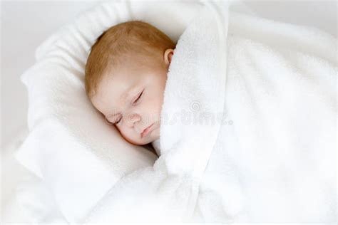 Cute Adorable Newborn Baby Wrapped In White Blanket Sleeping In Kids