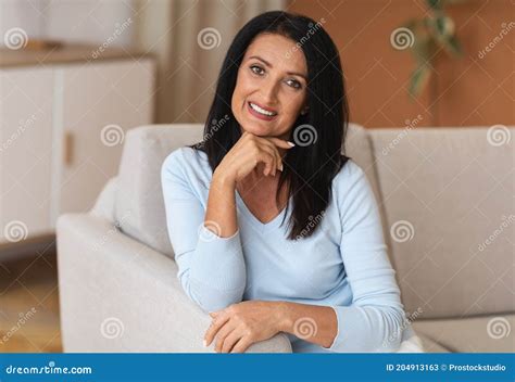 Portrait Of Lovely Middle Aged Brunette Lady Smiling Stock Image