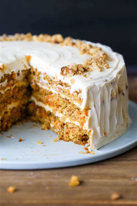 the best carrot cake recipe with fresh carrots and pineapples topped with a cream cheese