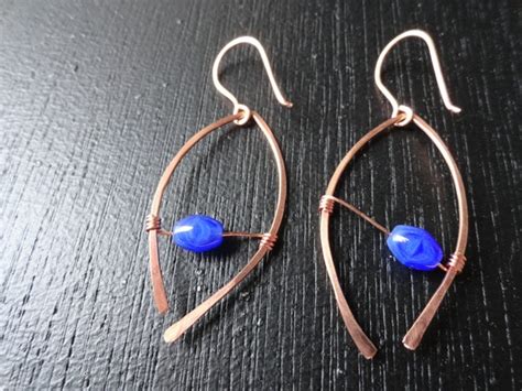 Items Similar To Hammered Copper Wire Earrings With Blue Glass Beads On