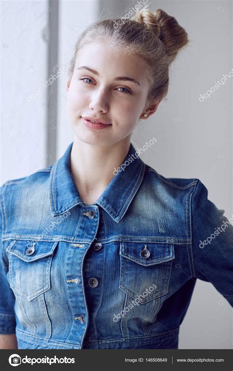 Blonde Female Dressed In A Denim Jacket Stock Photo Fxquadro