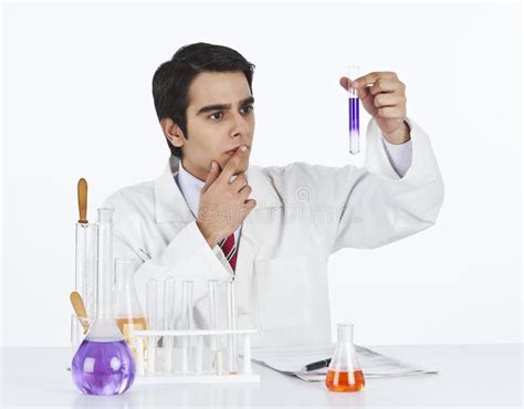 Scientist Doing Scientific Experiment In A Laboratory Stock Image