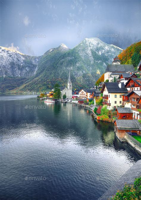 View Of Famous Hallstatt Lakeside Town Reflecting In Hallstattersee