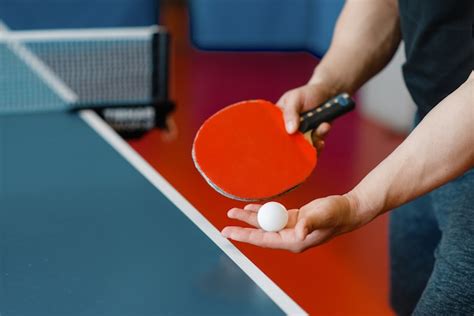 Premium Photo Male Person Hands With Ping Pong Racket And Ball