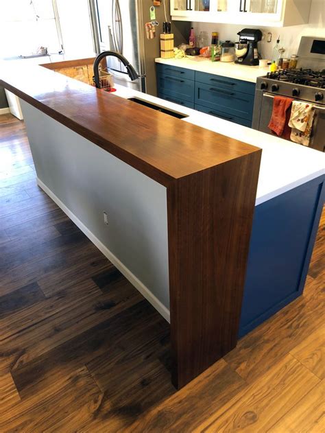Maybe you would like to learn more about one of these? Walnut raised bar island with waterfall ends Click to see ...