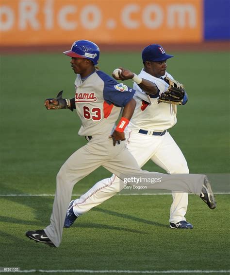 Dominican Republics Miguel Tejada Makes A Catch And Throws To First