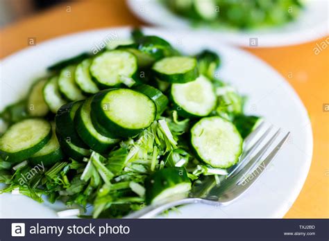 Home Or Restaurant With Table And Green Salad Dish Closeup With