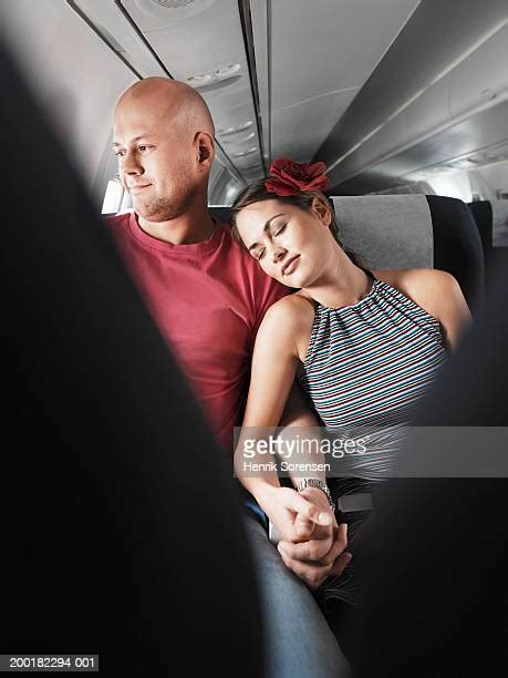 Couple Holding Hands On Airplane Photos And Premium High Res Pictures