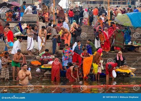 bathing at the hindu ghats in the holy river ganges varanasi india editorial image