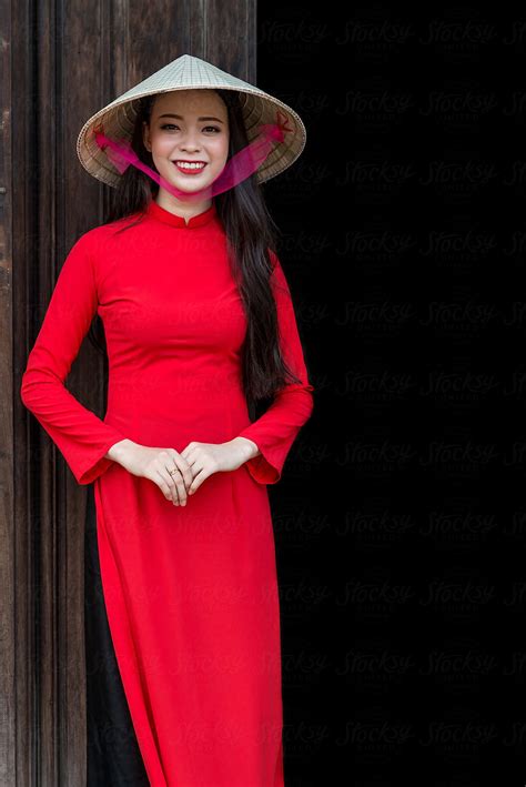Vietnamese Woman In Red Ao Dai Traditional Costume And Conical Hat By