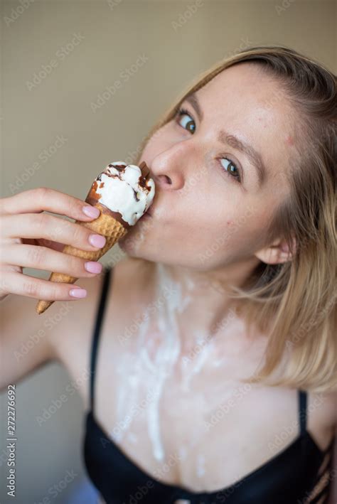 Sexy Blonde Licks A Waffle Cone Ice Cream Is Melting Erotically Draining Through The Body Of